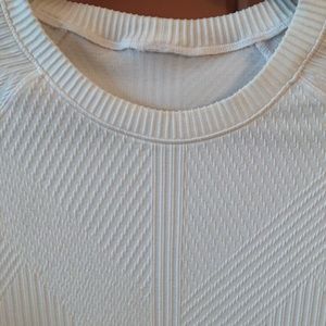 Lululemon dbl knit long sleeve white top with white on white pattern. Worn once.